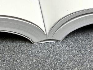 Book bound using layflat binding technique